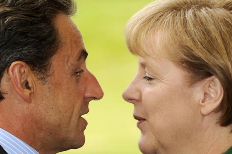 Nicolas Sarkozy y Angela Merkel. | Afp