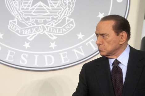 El primer ministro italiano, Silvio Berlusconi, en una reunión en Milán. | Efe