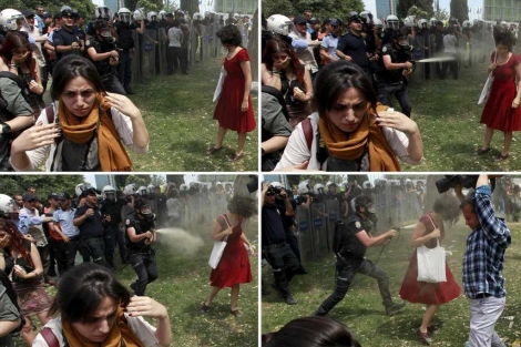 La mujer de rojo se convirtió en símbolo de la protestas en el parque Gezi. | Reuters